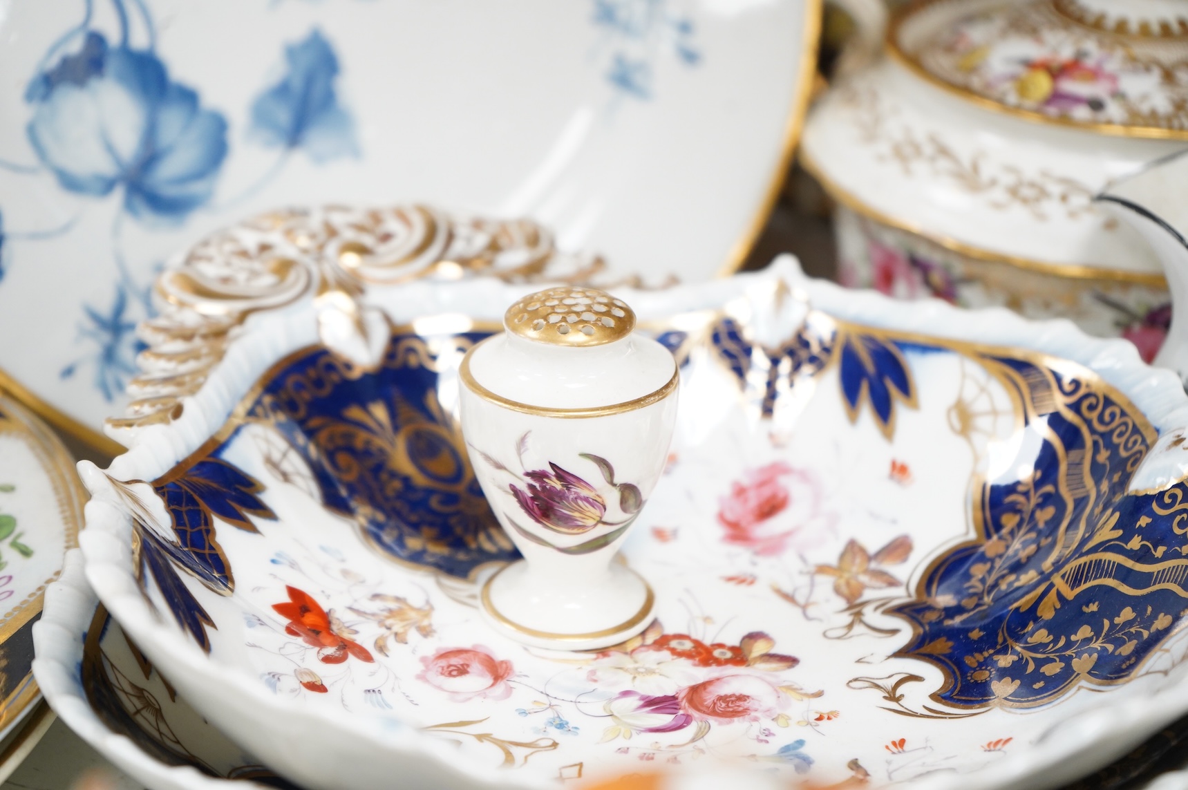 A collection of early 19th century English porcelain tea, dessert and dinner wares including Derby dessert plates, Bloor Derby, Barr Flight & Barr plate, Spode, Coalport etc.